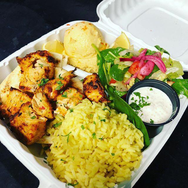 Chicken Shish Kebab · Cubes of succulent marinated chicken breast, grilled or fried to perfection served with rice, salad, a scoop of hummus and white sauce.
