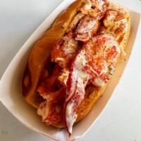 Lobster roll · rolls are served with 4oz or 6oz . Wild-caught lobster  in a toasted, Buttered bun with Mayo...