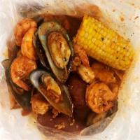Seafood Combo 1 · 1/2 lb. shrimp head off and 1/2 lb. green mussels. Served with 1 corn and 2 potatoes.