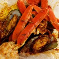 Seafood Combo 3 · 1/2 lb. snow crab legs and 1/2 lb. green mussels. Served with 1 corn and 2 potatoes.
