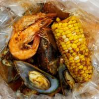 Seafood Combo 5 · 1/2 lb. shrimp head-on and 1/2 lb. green mussels. Served with 1 corn and 2 potatoes.