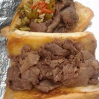 Beef Sandwich · Chicago style beef on garlic toasted roll with choice of natural gravy or red sauce and choi...