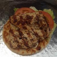Char Chicken Sandwich · House marinated chicken breast,  char grilled served on choice of pita, French bread or brio...