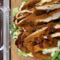 Country Salad · Country chicken salad. Fried chicken, romaine lettuce, shredded mozzarella, corn, bacon, and...