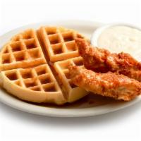 Chicken and Waffles · 2 pieces of chicken tenders on a fluffy Belgian waffle. Comes with gravy 