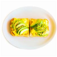 Breakfast Avocado Sandwich · With two scrambled eggs with sesame seasoning.