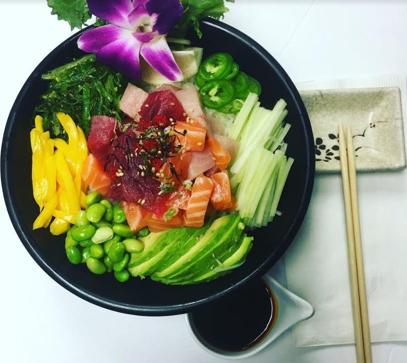 Poke Rainbow Bowl · Tuna, salmon, yellowtail, seaweed salad, edamame, mango, cucumber, furekaki, green onion, avocado, kizami nori, tobiko and jalapenos.