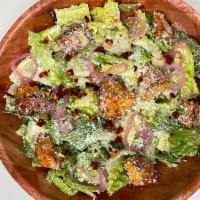 Spicy Caesar Salad · Gem lettuce, spicy croutons, Caesar dressing, Parmesan.