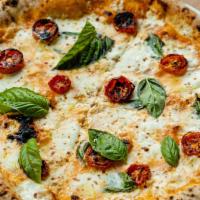 Vodka Pizza · VODKA SAUCE, CHERRY TOMATOES, MOZZARELLA, BASIL