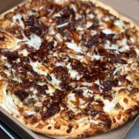 Smokey BBQ Chicken Pizza · BBQ chicken, sliced onions with mozzarella and Parmesan cheese.