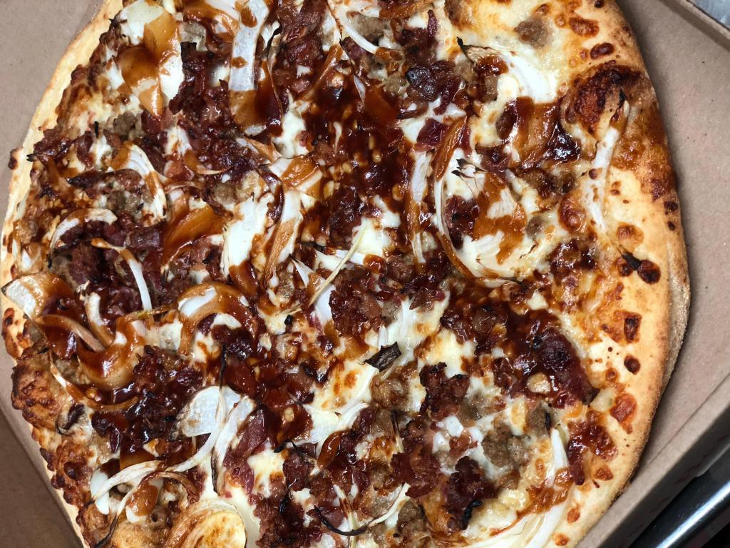 Bacon Cheeseburger Pizza · Beef, onions, and bacon in BBQ sauce with mozzarella and cheddar cheese.