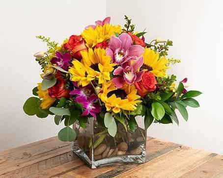 Celebration Arrangement · This vibrant arrangement adds a celebratory feel to all events and festivities!

-- Picture represents the Large version of this arrangement --

Seasonal options will vary throughout the year and depending on location. Our florist will provide the best available flowers for your order!