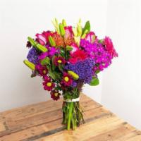 Vibrant Primary Colors Wrapped Bouquet · The colors of the rainbow in all of their showiest tones.

Seasonal options may vary through...