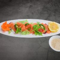 Salmon Tataki · Seared premium salmon with black pepper toasted sesame topped with thinly sliced tomato and ...