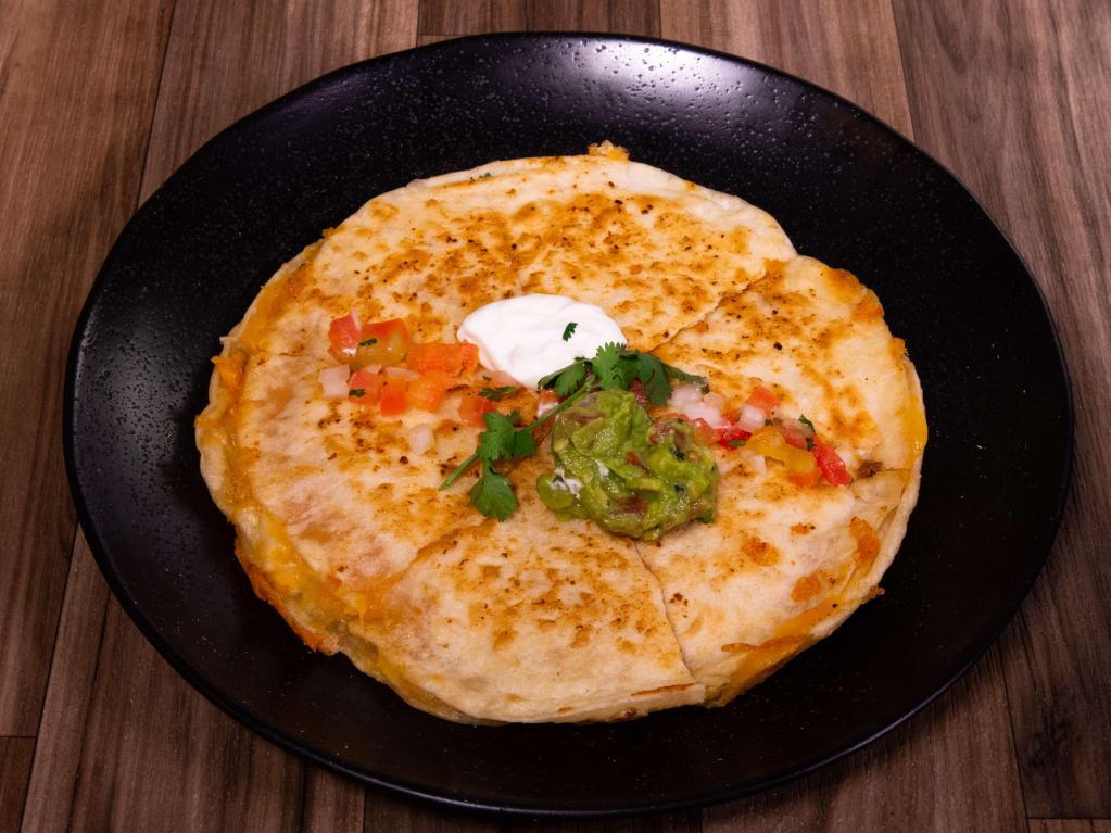 Quesadillas · Served with guacamole and sour cream.