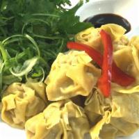 A6. Thai Dumplings · Stuffed w. shrimp & chicken / assorted vegetables in wonton skin / soy vinaigrette dip
