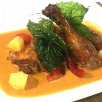 D2. Duck Curry · Half duck in red curry / coconut milk / tomato / pineapple / bell pepper / basil leaves
