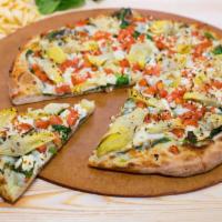 11. Green Monster Pizza · Artichoke pesto. Artichoke hearts, fresh spinach, Roma tomatoes, fresh garlic, feta and mozz...