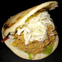 Beef Arepa · A grilled corn Arepa with our seasoned Shredded beef, mozzarella cheese, avocado sauce and m...
