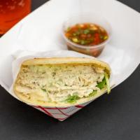Arepa El Pilon · A grilled corn Arepa with white shredded chicken, Pilon sauce, avocado sauce and shredded mo...