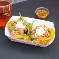 Beef Patacon · 2 Savory fried plantain cups with our seasoned shredded beef, mozzarella cheese, mixed green...