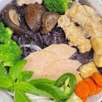 41A. Black Rice Vegetable Pho · Freshly made noodles from black rice with tops of shiitake mushroom, tofu, veggie ham, gobo ...