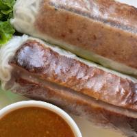 A6. Grilled Pork Spring Roll (2) · Grilled pork, pickled carrot and daikon, cucumber, and vermicelli.