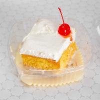Tres Leches Cake · Cold cake soaked in three delicious milks and covered with satiny white cream topping. 6 oz.