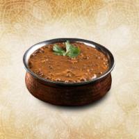 Creamy Black Lentils  · Black lentils slow cooked till tender and tempered with Indian spices and finished with fres...