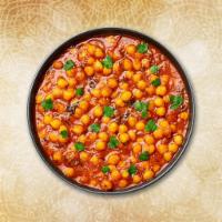 Tangy Chickpea Curry · Garbanzo beans cooked with tomatoes and special blend of spices