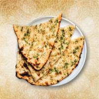 Garlic Blast Naan · Soft and fluffy flatbread infused with garlic flavor
