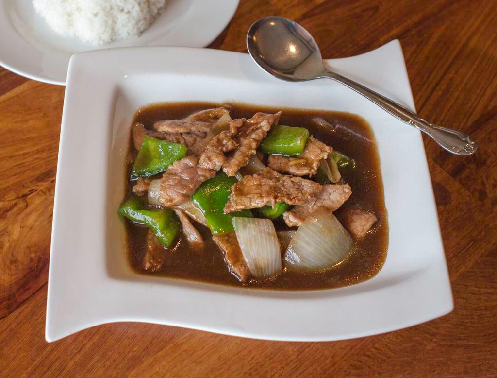 Pepper Steak · Stir fried marinated sliced tender beef with bell peeper and onion in house brown sauce. Served with choice of rice.