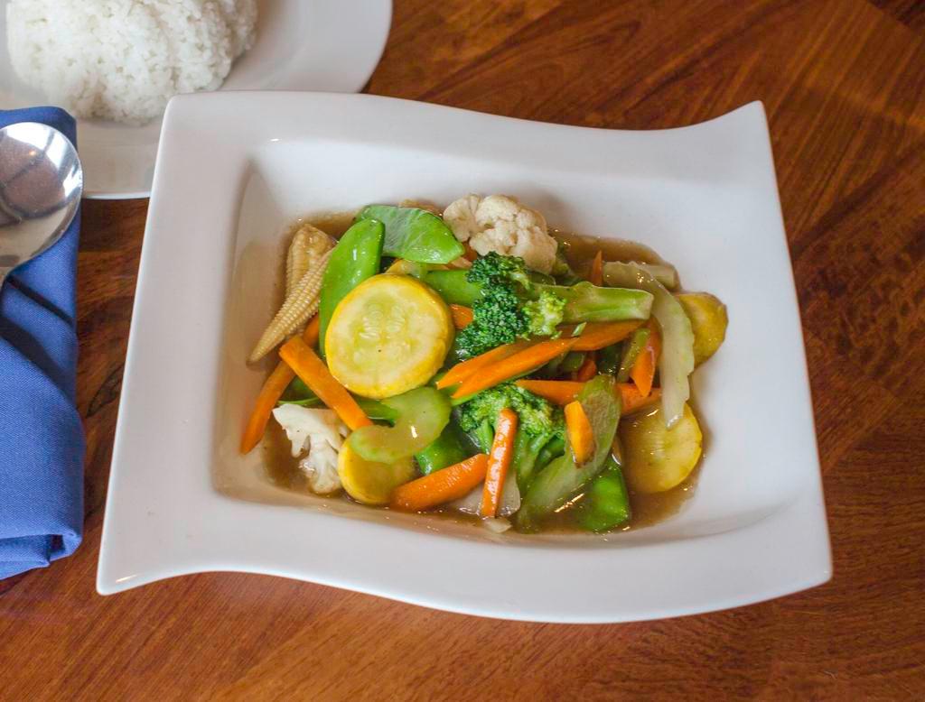 Mix Vegetables with Meat · Stir fried assorted vegetables in light brown sauce. Served with choice of protein and choice of rice.