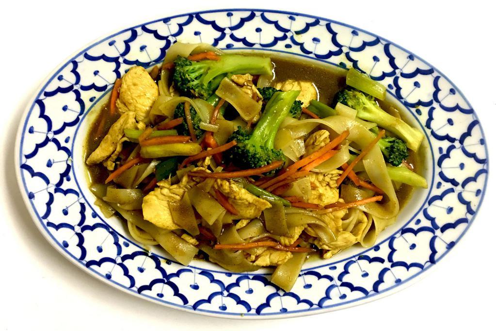Singaporean Noodles · Stir fried rice noodles with yellow curry, broccoli, carrots and green onions. Served with choice of protein. Hot and spicy.