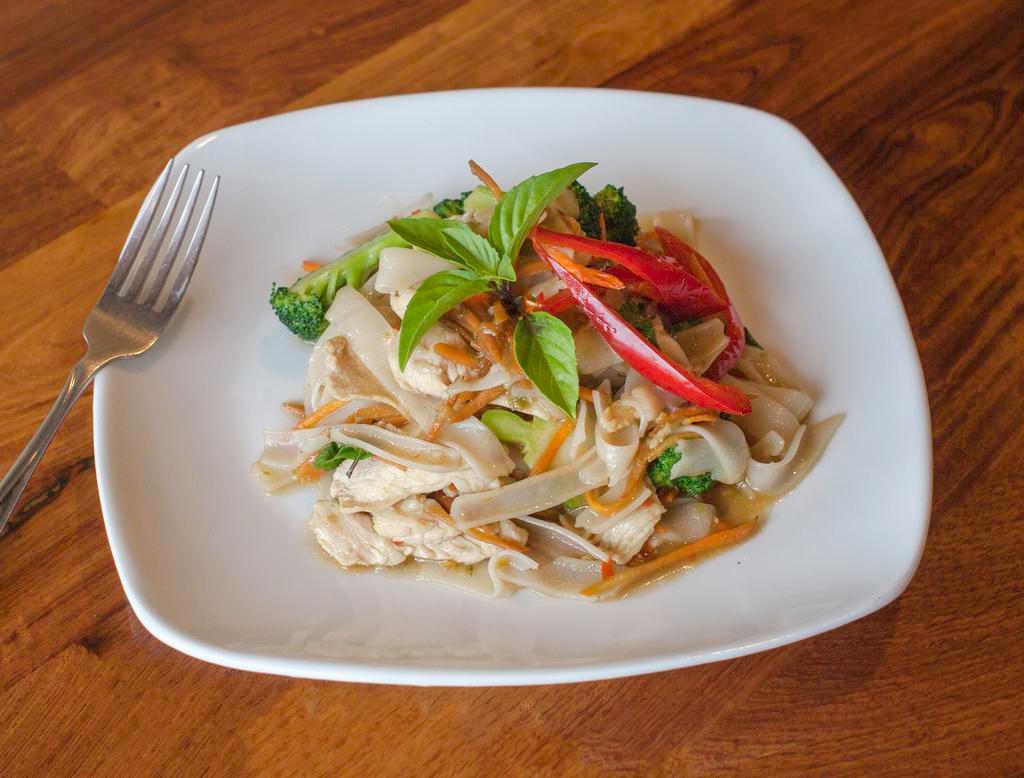 Drunken Noodles (Phad Kee Mao) · Stir fried rice noodles with broccoli, carrots, Thai basil and very spicy chili sauce. Served with choice of protein. Hot and spicy.