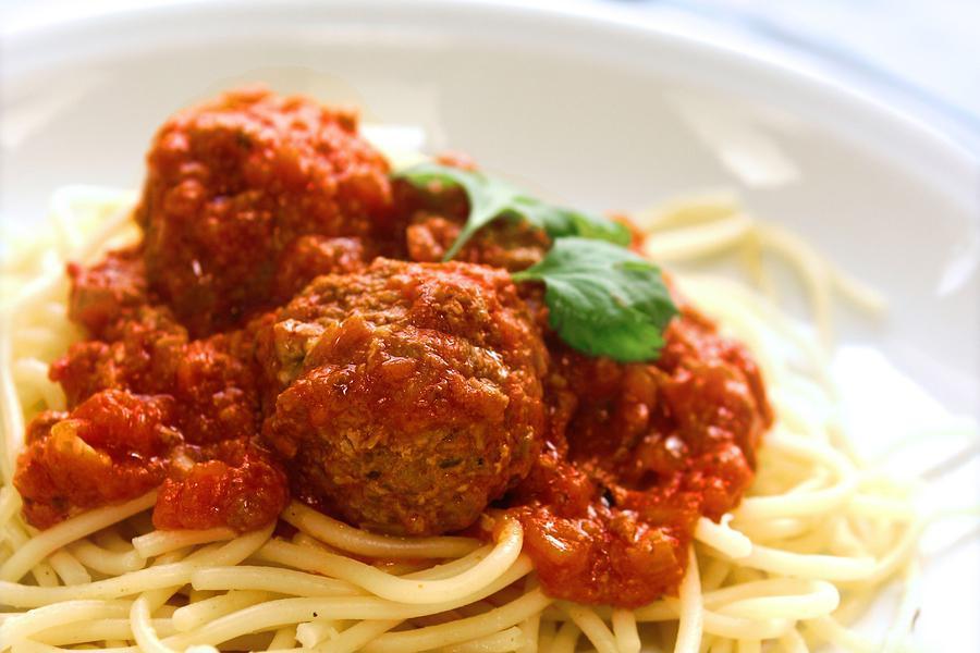 Spaghetti & Meatballs · Spaghetti topped with Pomodoro sauce and meatballs.