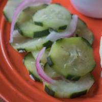 Cucumber Salad · Crisp and tangy Cucumber salad with red onions.

Gluten free. Vegan. Vegetarian.