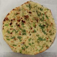 Garlic Basil Naan Bread · Flat bread topped with garlic and basil - chef's recommendation.
