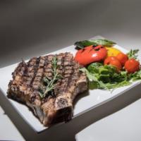 Rib Eye Steak · Served with grilled vegetables.
