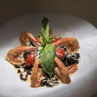 Black Fettuccine with Shrimp · Squid ink pasta, with basil sauce and Parmesan cheese.