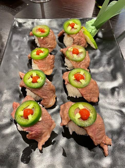 King Miller Roll · Rice with chefs special sauce  topped  with A5 Japanese Wagyu Garnished with a Fresh jalapeño and a splash of sriracha sauce