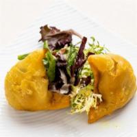 Samosa · Spiced potatoes & peas, pastry wrapped.