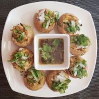 Fuchka (Pani-puri) · hollow poori filled with seasoned potato & chickpeas. served with tamarind water.
Note: to r...