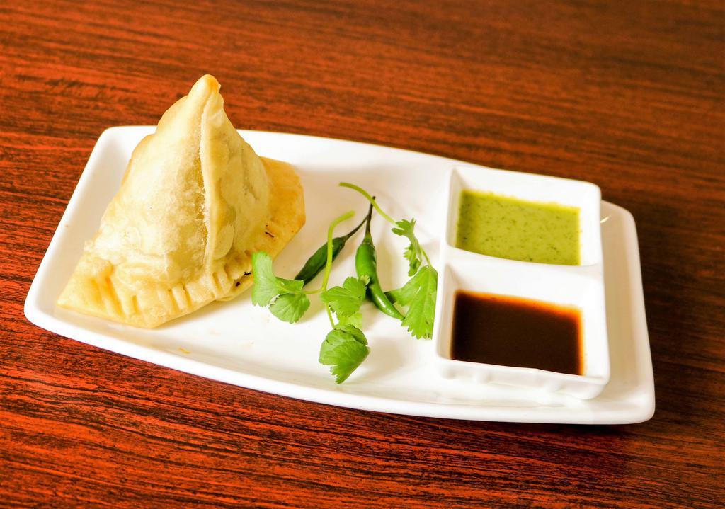 Chicken Samosa (2 pieces) · A turnover filled with minced chicken. 