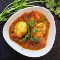 Egg Curry · Ultimate Bengali Egg Curry prepared with boiled eggs,   onion, tomatoes and earthy spices.
