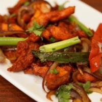 Chicken 65 · Marinated chicken stir-fried with curry leaves and onions and peppers. 