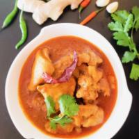 Chicken Curry · Boneless chicken cooked with our own blend of garam masala. 