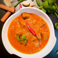 Lamb Bhuna Curry · slow-cooked boneless lamb with our own blend of roasted garam masala. 