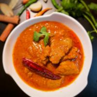 Beef Bhuna Curry · Boneless beef marinated and slow-cooked with roasted spices.