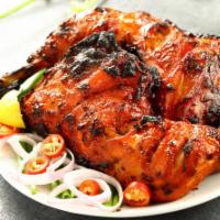 2 Piece Tandoori Chicken · 1/2 a Chicken  marinated with yogurt and herbs, cooked in a Tandoor.
